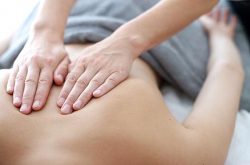 Person receiving massage therapy treatment
