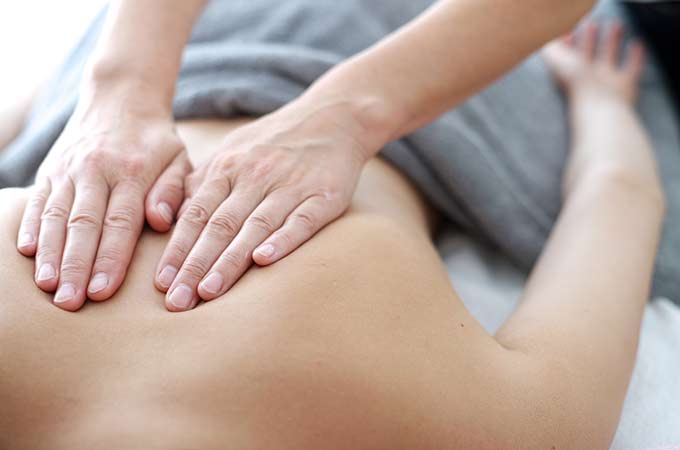 Person receiving massage therapy treatment