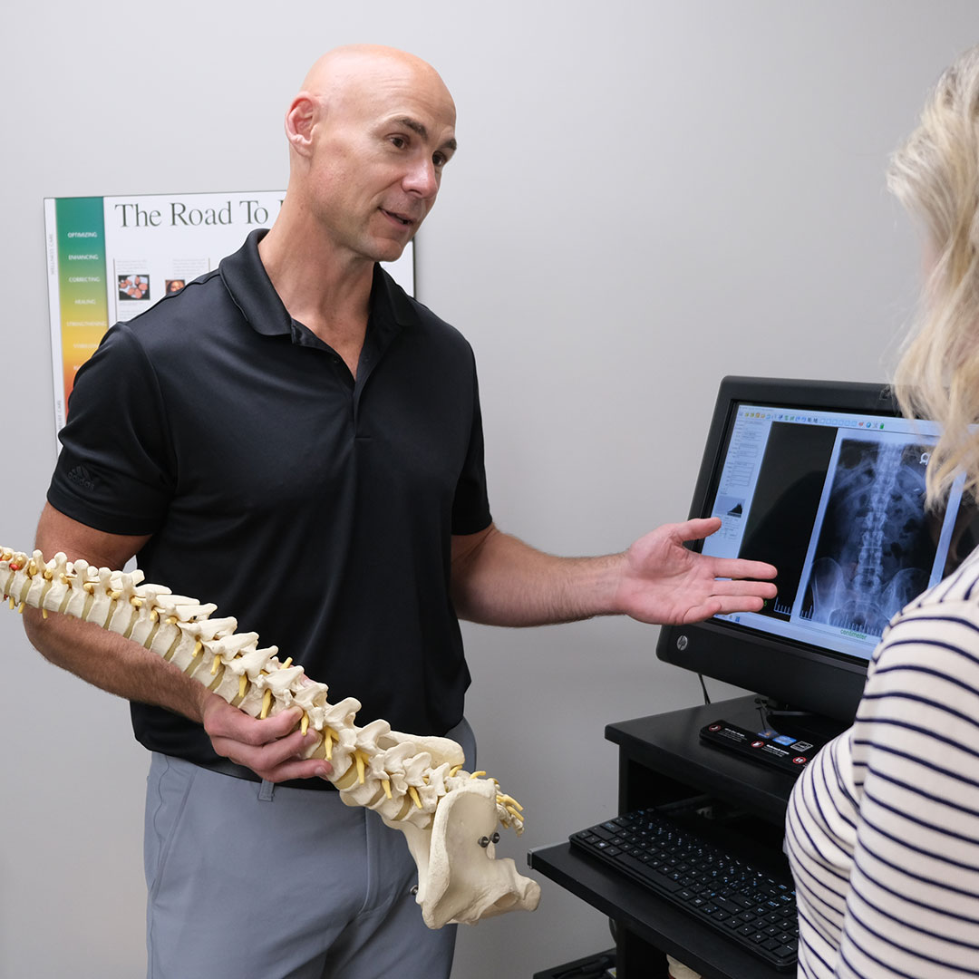 Dr. Aaron Cain talking to patient about x-ray results